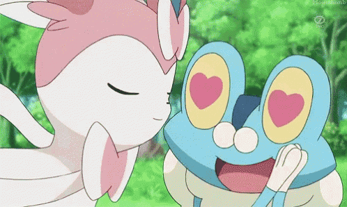 a frog and a cat are kissing each other .