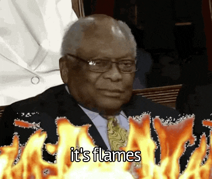 a man in a suit and tie is surrounded by flames with the words it 's flames below him