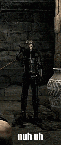 a video game character is standing in front of a brick wall with the words nuh uh on the bottom