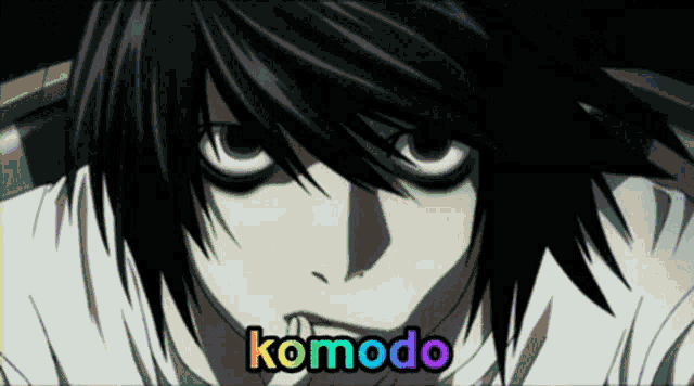 a close up of a person 's face with komodo written in rainbow colors