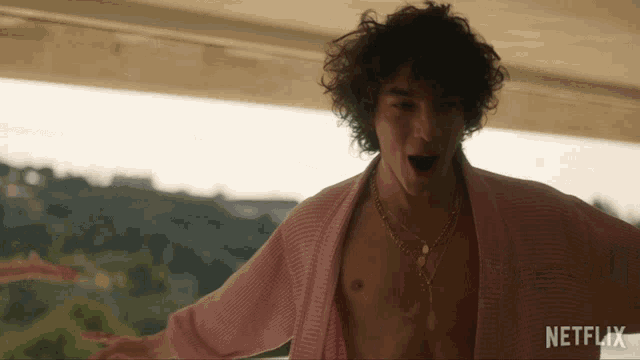 a man in a pink robe with a netflix logo on the bottom