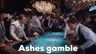 a group of people are playing roulette in a casino and the words ashes gamble are on the screen .