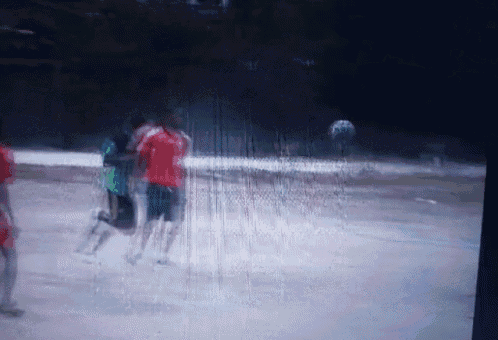 a blurry picture of a group of people playing a sport