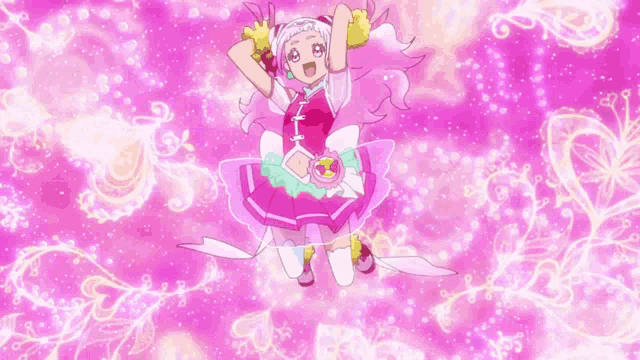 a girl in a pink dress is flying in the air with her arms outstretched