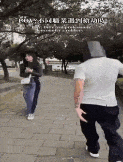 a man with a cardboard box on his head is standing next to a woman