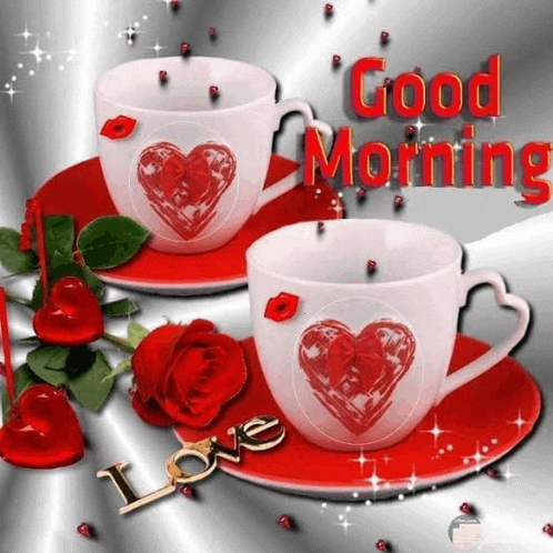 two cups of coffee with hearts on them and roses on a saucer with the words `` good morning '' written on it .