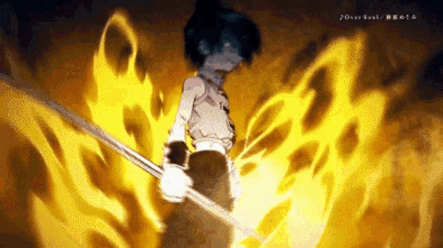 a person holding a stick in front of a fire