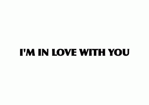 a white background with the words `` i 'm in love with you '' written in black letters .