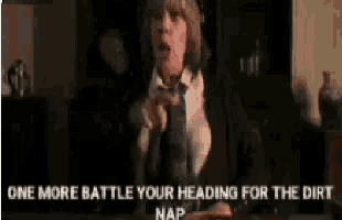 a woman wearing headphones and a tie says one more battle your heading for the dirt nap