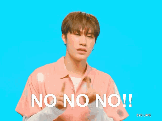 a young man in a pink shirt says no on no