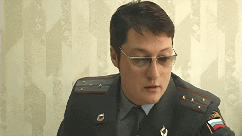 a man in a military uniform has a patch on his arm that says ' russia ' on it