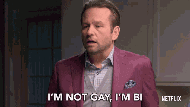a man in a purple suit says " i 'm not gay , i 'm bi "