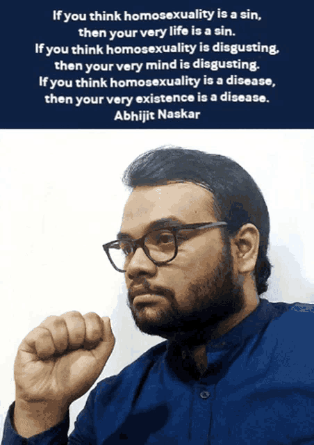 a man wearing glasses holds his fist up in front of a quote by abhijit naskar