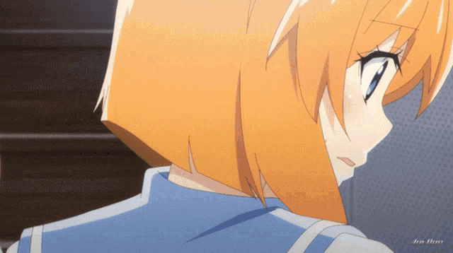 a close up of a girl with orange hair and a blue shirt that says ain films