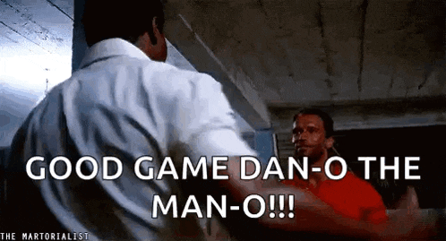 two men are standing next to each other in a room and one of them is saying `` good game dan-o the man-o '' .
