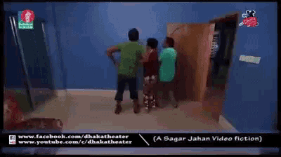 a man in a green shirt is holding a woman in a green shirt in a room