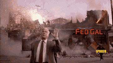 a man in a suit and tie is standing in front of a building that says fed gal