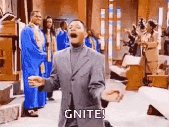a man in a suit is kneeling down in front of a choir in a church and shouting .
