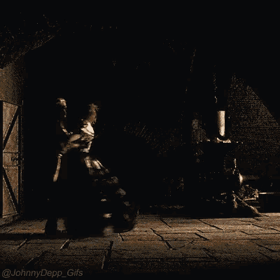 a couple dancing in a dark room with the words johnny depp gifs on the bottom