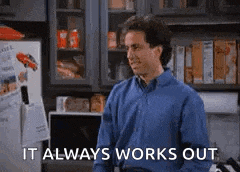 a man in a blue shirt is standing in front of a refrigerator in a kitchen and saying `` it always works out '' .
