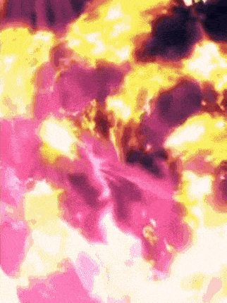 a close up of a pink and yellow background with a blurred effect .