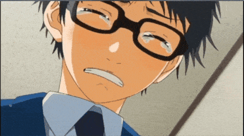 a boy wearing glasses is crying with tears running down his face