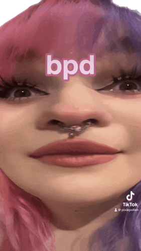 a close up of a woman 's face with the word bpd on it