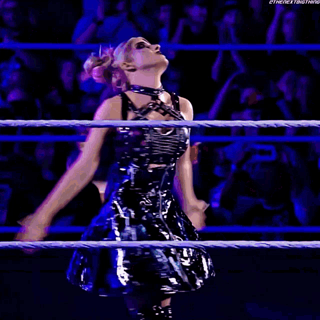 a woman is standing in a wrestling ring with the hashtag #thenextbigthing