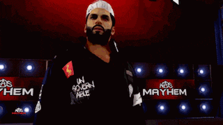 the word mayhem that is on a red wall