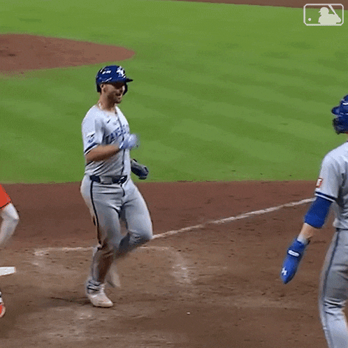 a baseball player wearing a jersey that says kansas city