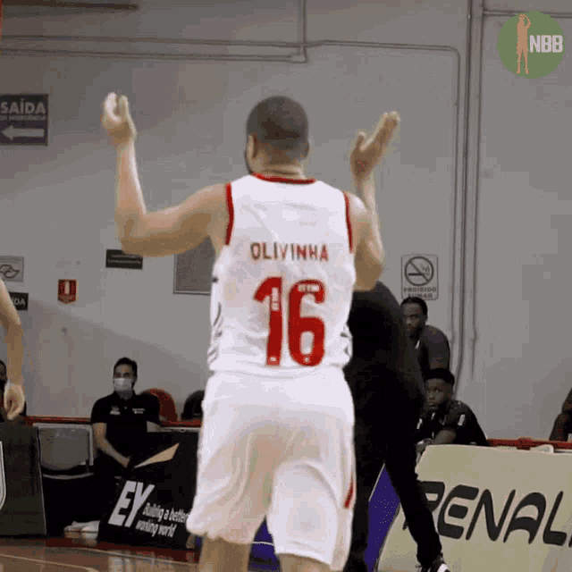 a basketball player wearing a number 16 jersey
