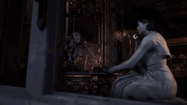 a woman in a white dress is looking at herself in a mirror