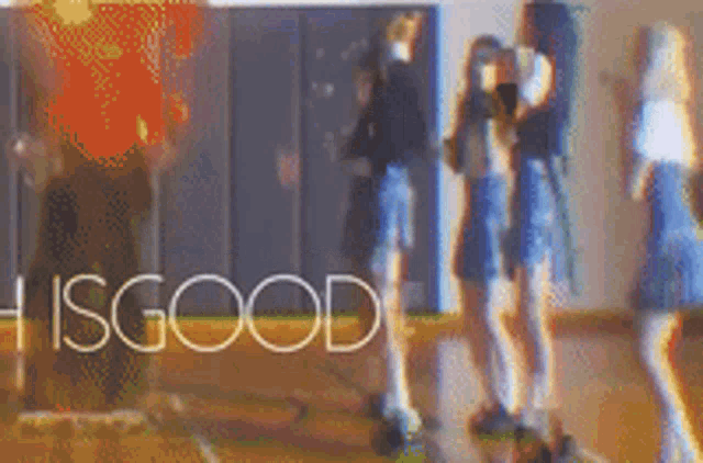 a group of people are standing in a gym with the words " hisgood " in the corner