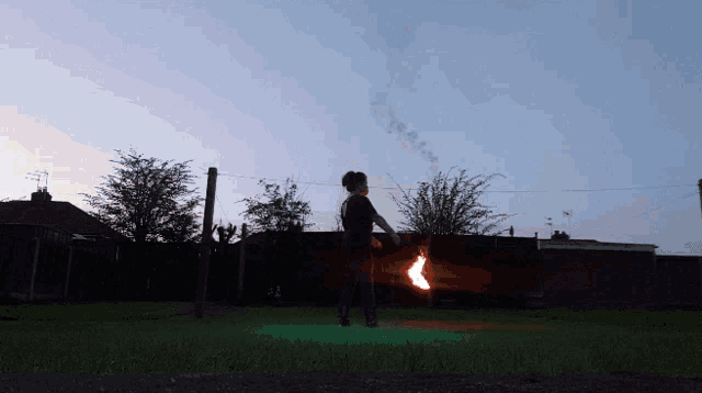 a person holding a torch with smoke coming out of it 's mouth