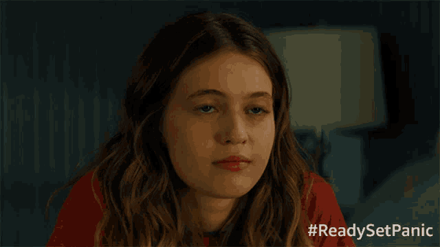a girl in a red shirt with #readysetpanic written below her