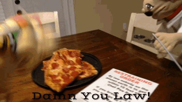 a slice of pepperoni pizza is on a plate next to a sign that says restraining order