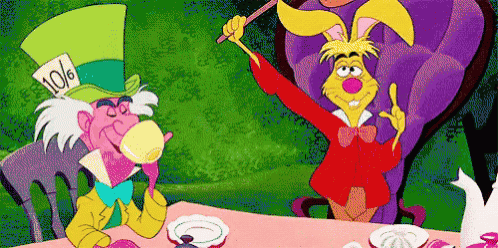 the mad hatter from alice in wonderland is holding a wand