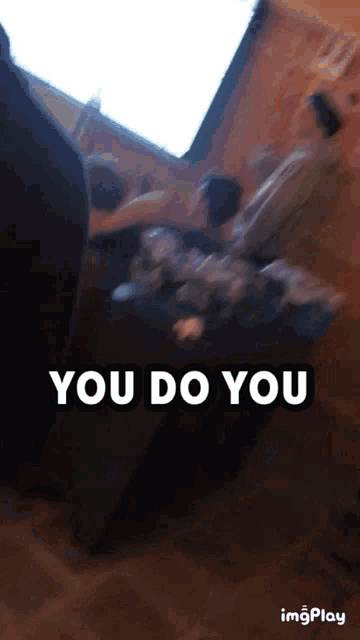 a blurry picture of a group of people with the words " you do you "