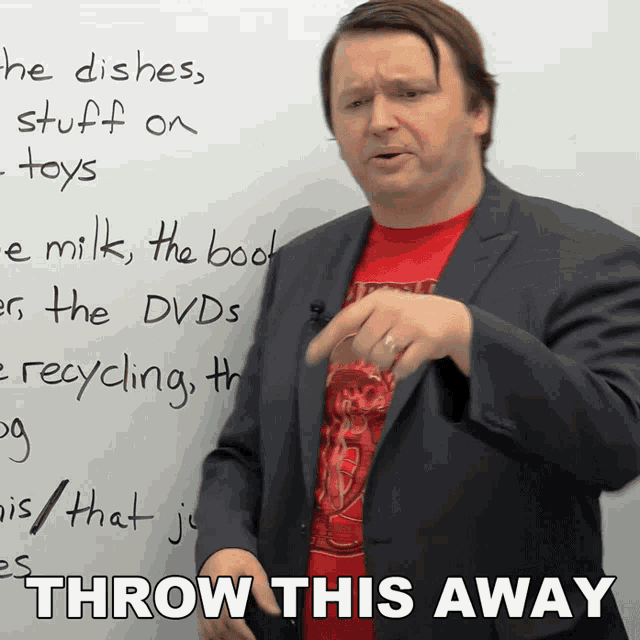 a man stands in front of a white board with the words throw this away written on it
