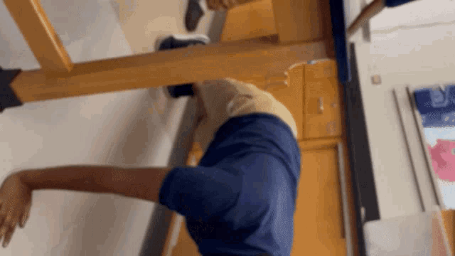 a person is doing a handstand in front of a mirror
