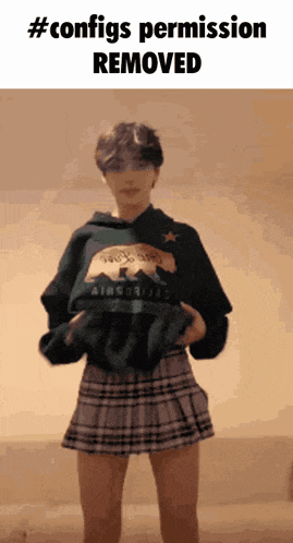 a person wearing a hoodie and a plaid skirt with the words " configs permission removed " on the bottom