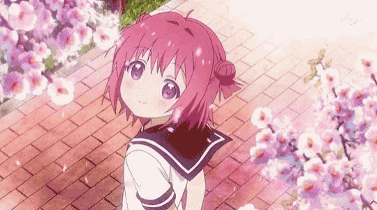 a girl with pink hair and purple eyes is standing on a brick sidewalk in front of a cherry blossom tree .