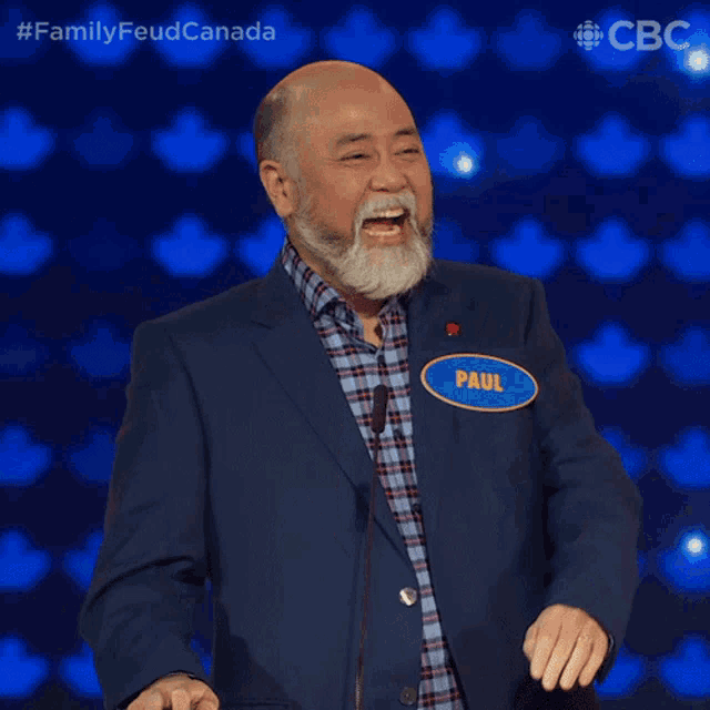 a man with a beard and a name tag that says paul