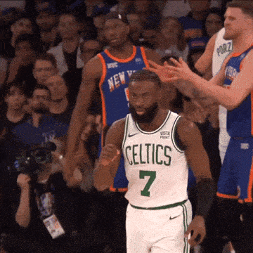 a basketball player wearing a celtics jersey number 7