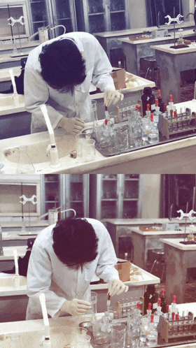 a man in a lab coat is pouring liquid into a beaker