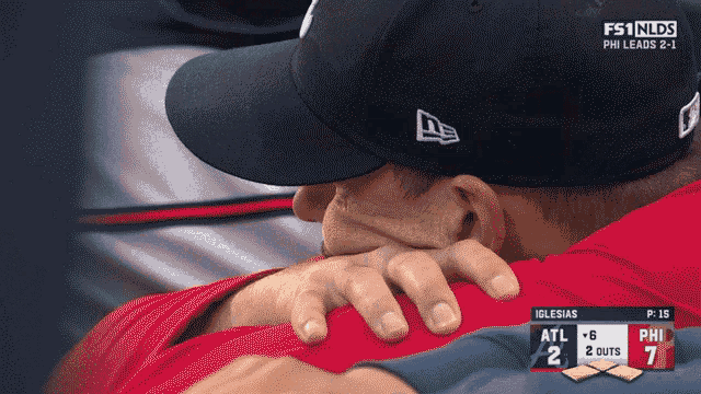 a baseball game is being played between the atl and phi teams