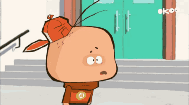 a cartoon character with the letter b on his chest is standing in front of a door