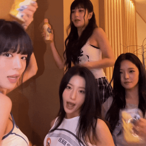 a group of girls are posing for a picture and one of them is wearing a shirt that says " яян " on it