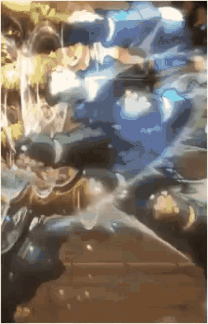 a blurry picture of a person sitting on a table with a bottle of water coming out of their mouth .