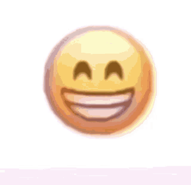 a close up of a smiley face with a big smile on it .